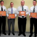 The Iowa City Hy-Vee store directors with their certificates recognizing their achievement. 